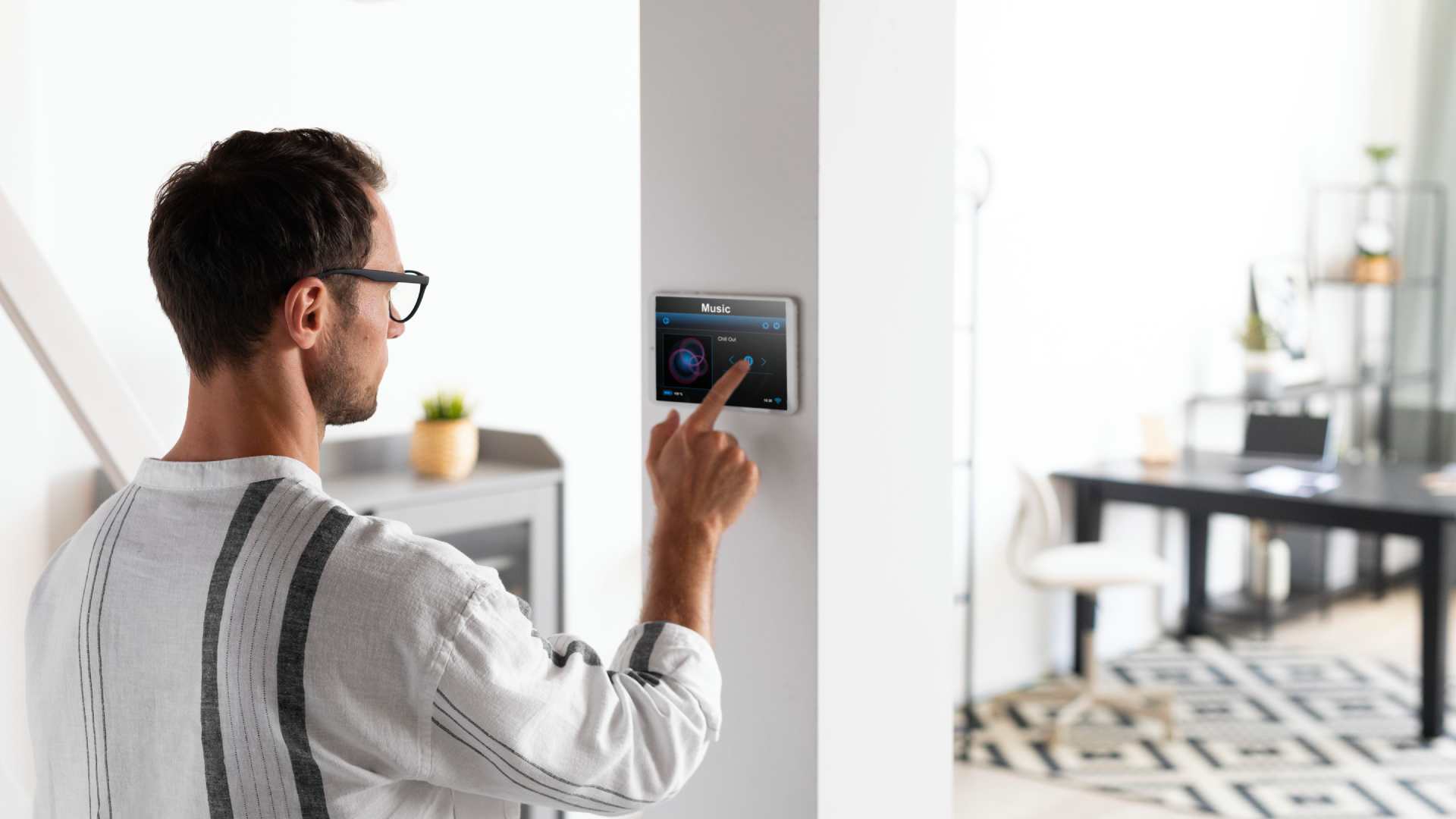 man-using-tablet-his-smart-home-1